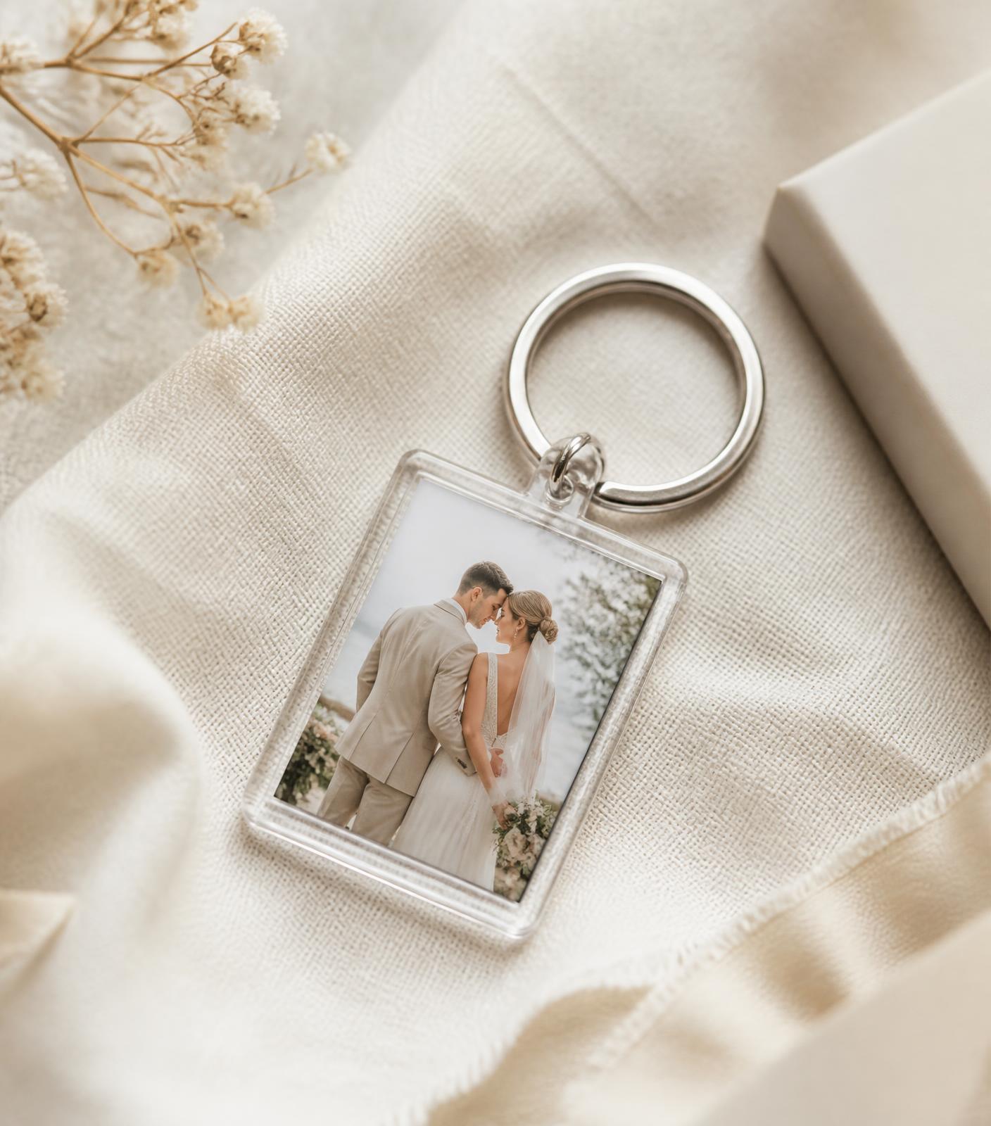 A finished personalised photo keyring resting on ivory linen